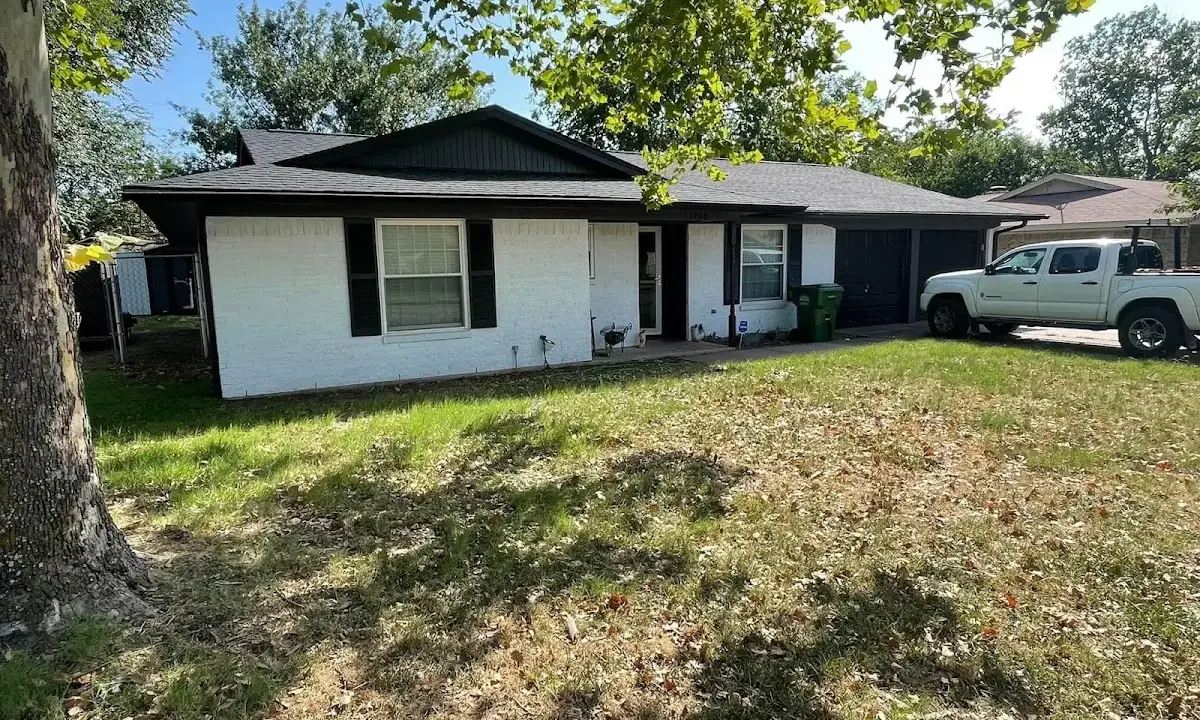 Professional roofing crew working on a residential roof in Morgan City